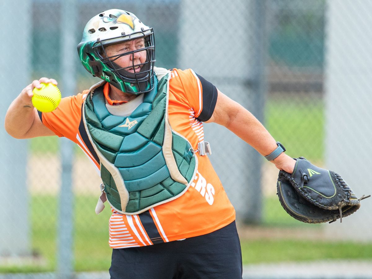 Masters catcher throwing softball