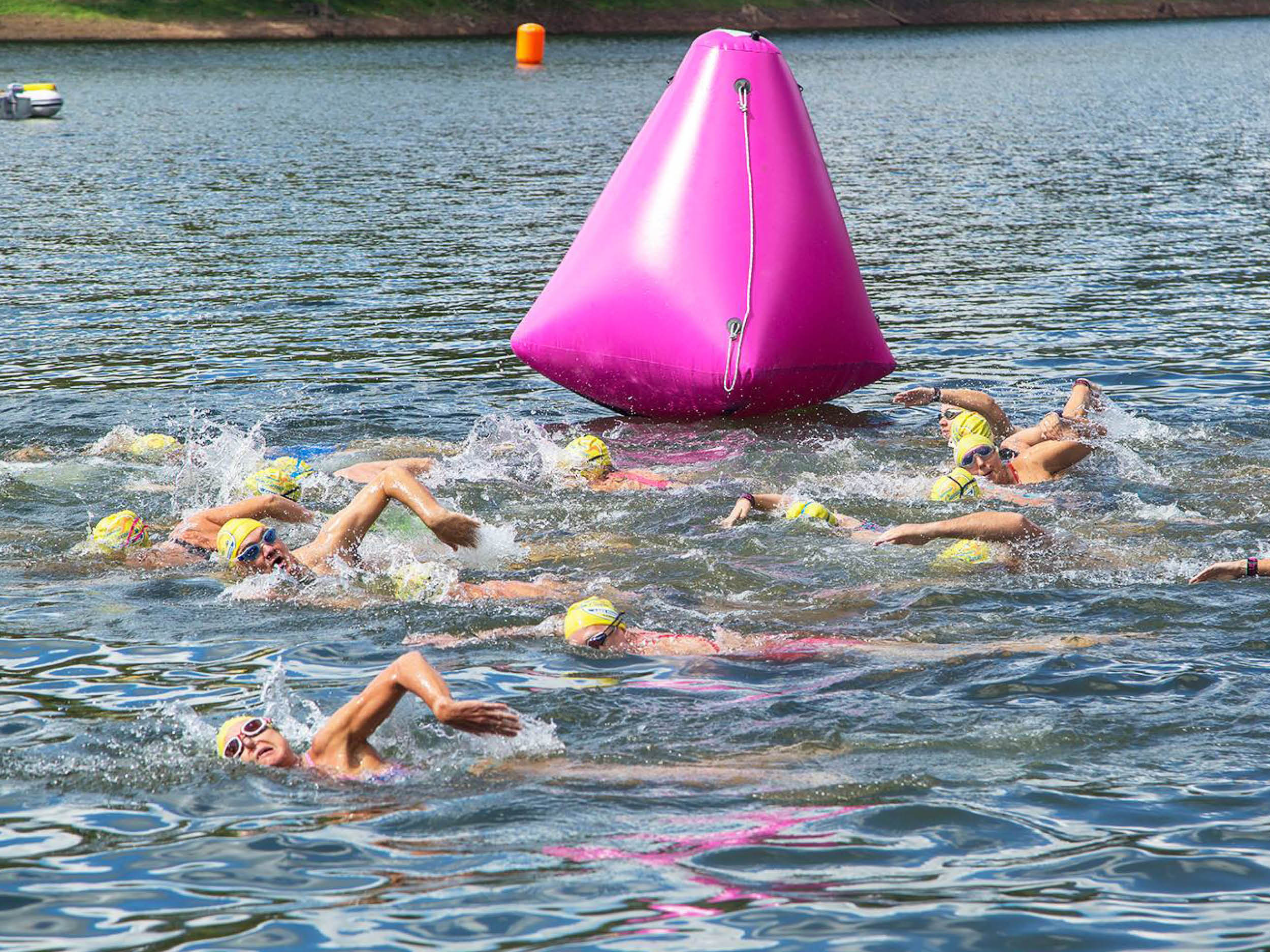 competitors participating in open water swim race