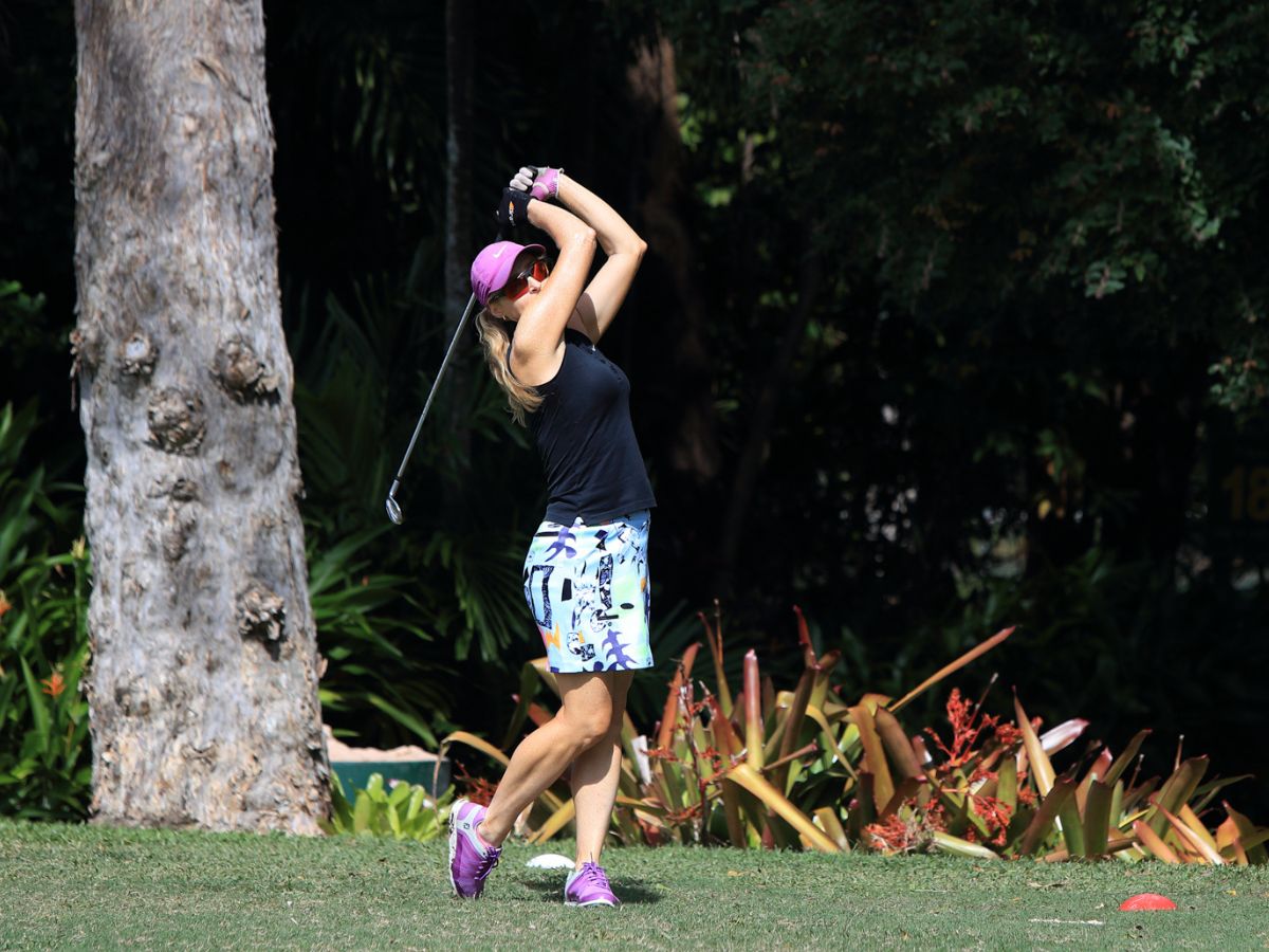 Masters woman hitting golf ball