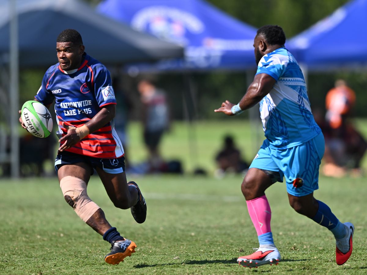 Masters man making a break carrying football