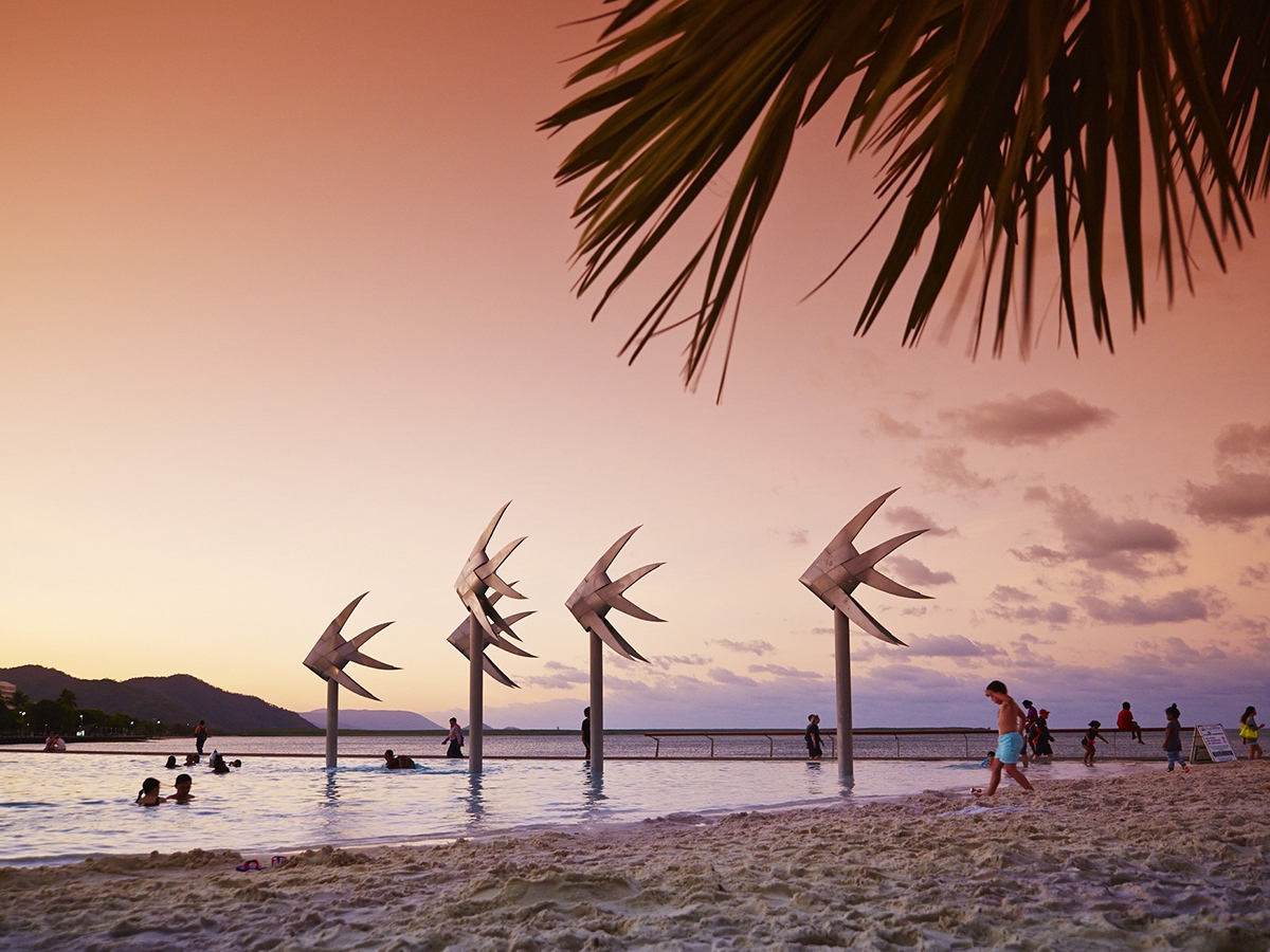 The Cairns Esplanade Lagoon features a large artistic fish sculpture rising gracefully from the water