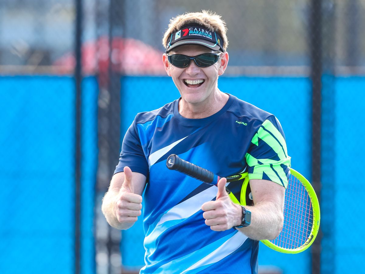 Male masters competitor smiling and giving thumbs up